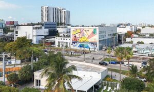 A monumental hand-painted mural titled “A Postcard to Rome” on a Miami Design District wall, fusing Fendi’s legacy with Miami flair